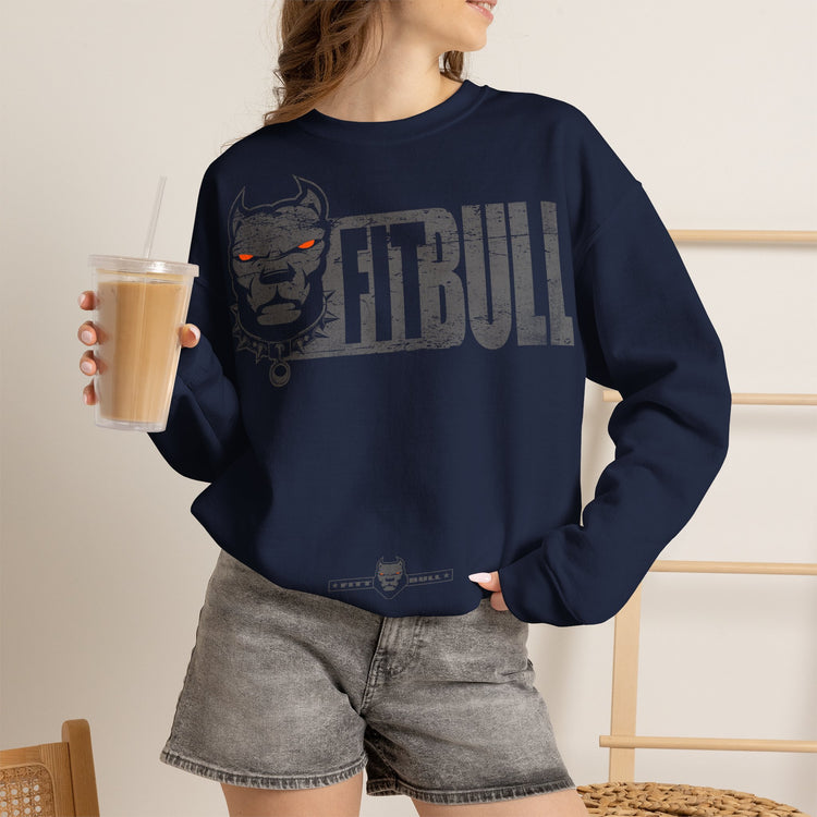 Person wearing a navy blue Fitbull sweatshirt , holding a drink.