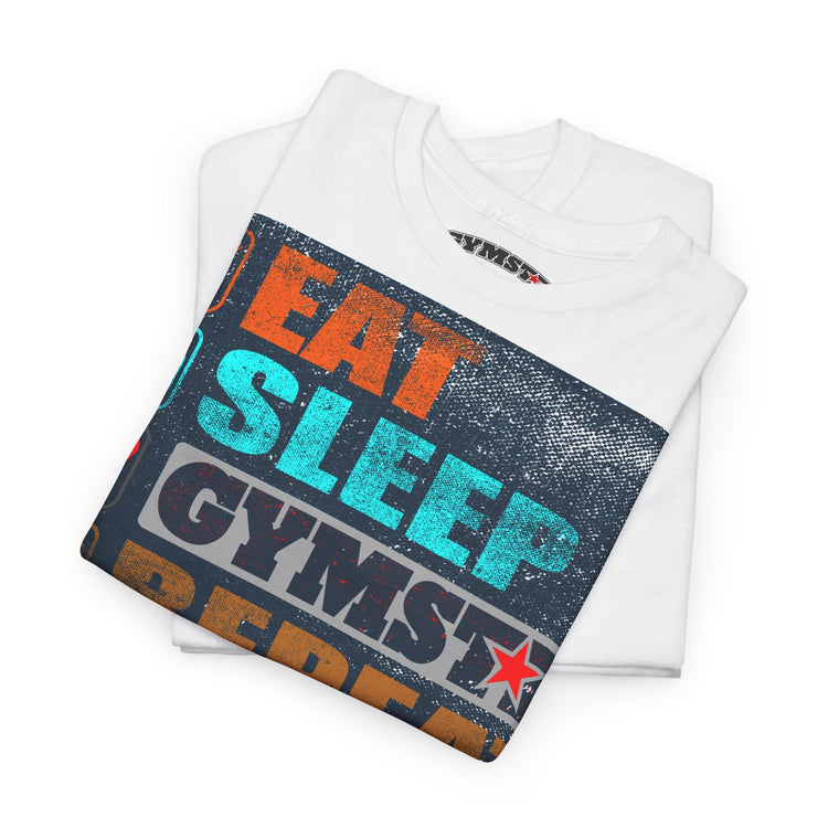 A folded white t-shirt with a colorful graphic print reading 'EAT SLEEP GYMSTRE' in orange, teal, and black distressed lettering, displayed on a clean white background.
