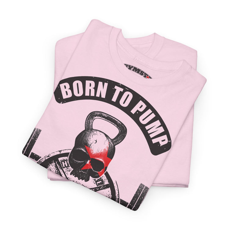 A folded light pink t-shirt featuring a graphic print of a skull wearing a black kettlebell mask, with a black banner above reading 'BORN TO PUMP' in white letters.