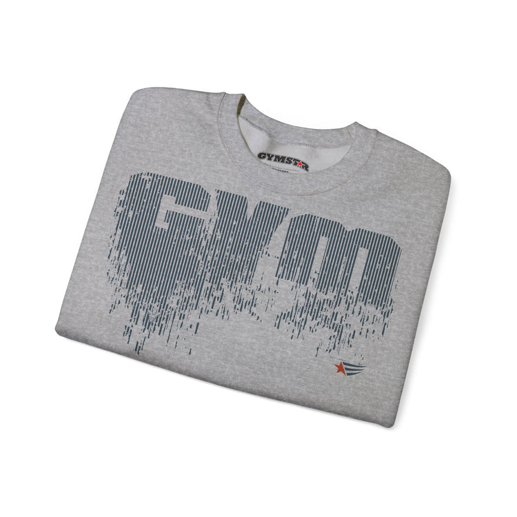 A folded heather gray crewneck t-shirt with a large distressed dark gray 'GYM' graphic on the front, a small red and blue logo near the bottom right, and 'GYMSTAR' printed inside the collar, shown on a white background.