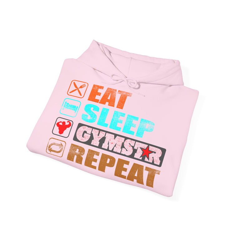 A light pink folded hoodie with a colorful graphic print on the front that reads 'EAT SLEEP GYMSTAR REPEAT' with small fitness-themed icons, shown on a plain white background.