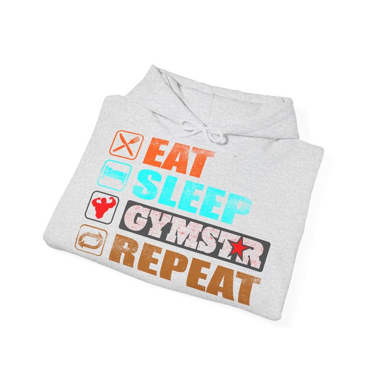 A light gray heather folded hoodie on a white background, featuring a colorful graphic print that reads 'EAT SLEEP GYMSTAR REPEAT' with small fitness-themed icons.
