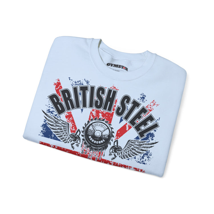 A light blue folded t-shirt with a distressed red, white, and black graphic on the front reading 'BRITISH STEEL' with wings and a central emblem. The inner collar shows the brand name 'GYMMASTER'.