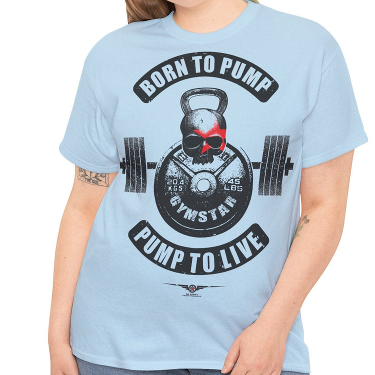 A woman modeling a light blue crewneck t-shirt with a gym-themed graphic that reads 'BORN TO PUMP' and 'PUMP TO LIVE' around a kettlebell and barbell design.