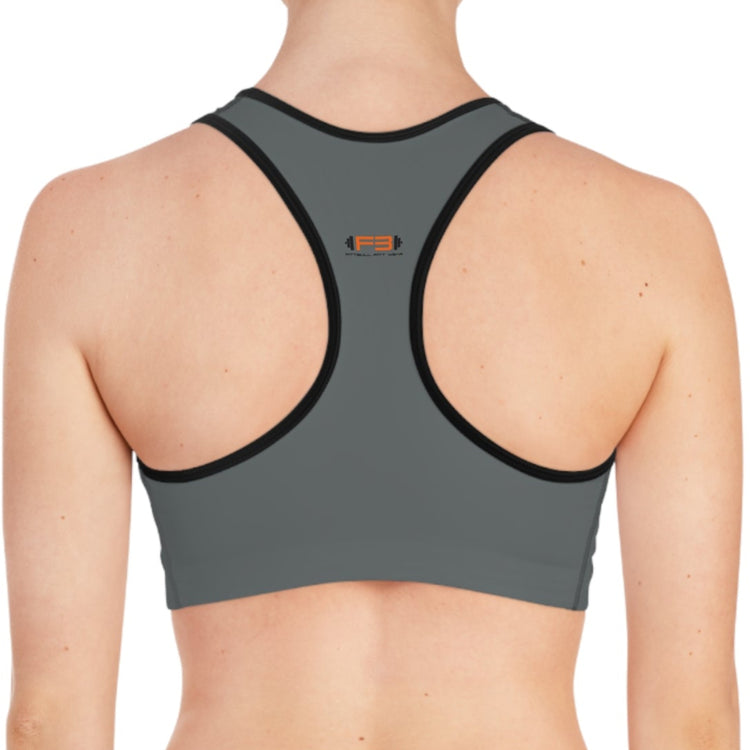 a woman wearing a charcoal-black sports bra fittbull-fitt-wear for crossfit training clothes back view