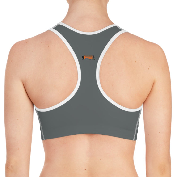 a woman wearing a charcoal-white sports bra fittbull-fitt-wear for crossfit training clothes back view