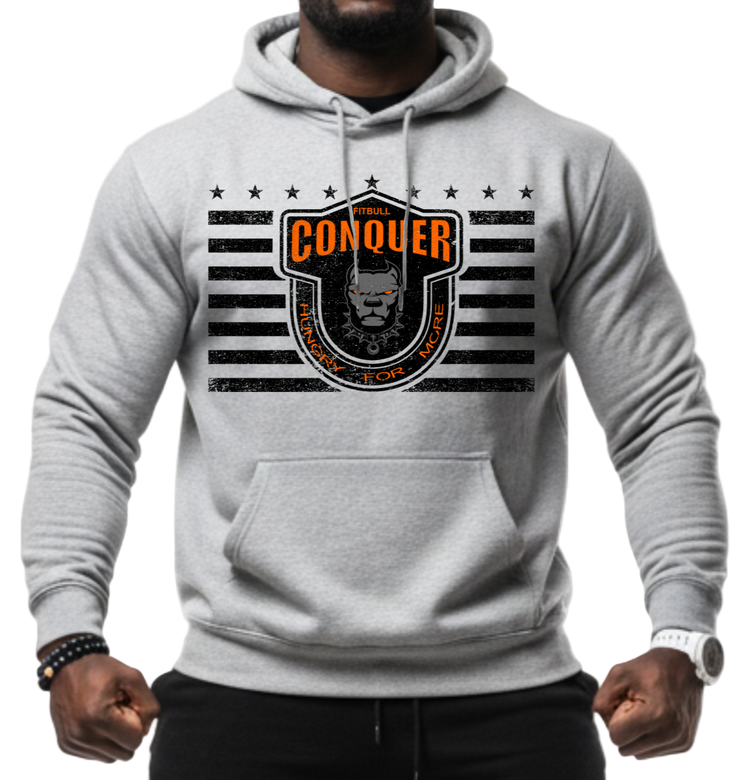Man wearing a grey Fitbull sporty hoodie with bodybuilding motivating design Conquer with orange accents.