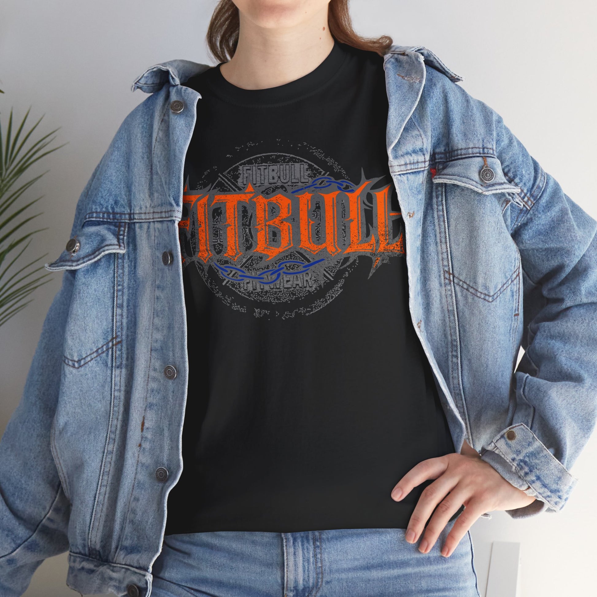 Person wearing a black Fitbull t-shirt with orange and blue text, paired with a denim jacket.
