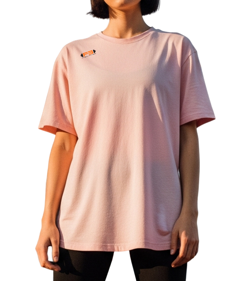 A woman wearing pink Fitbull fitness t-shirt with a motivating logo on the chest.