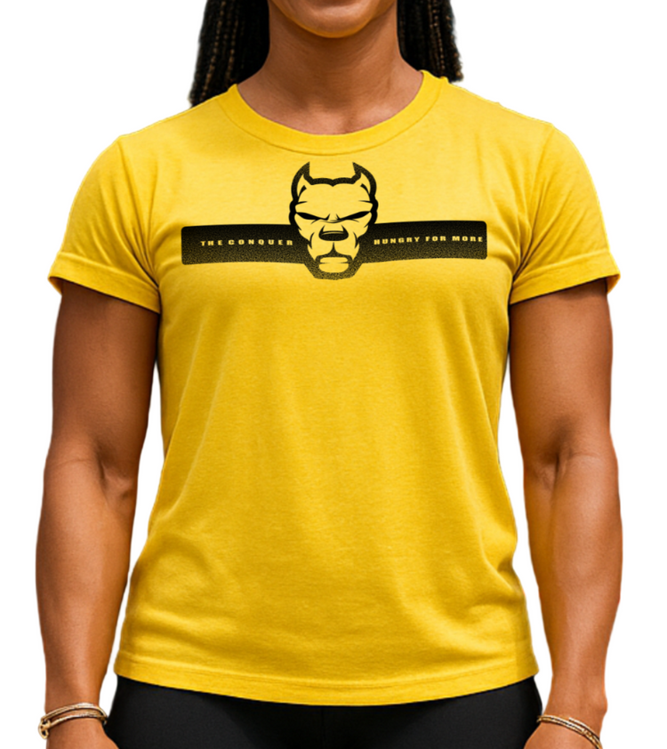 A muscular woman wearing a yellow Fitbull t-shirt with a logo and motivating Concuer design.