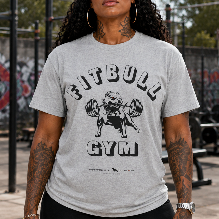 Woman wearing a gray 'Fitbull Gym' t-shirt outdoors.