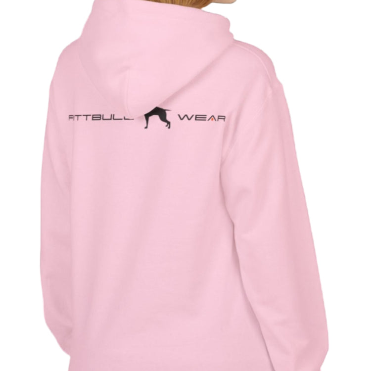 woman wear pink sporty hoodie for fitness and crossfit by the Fitbull brand, branded with a logo and a motivating motif side view