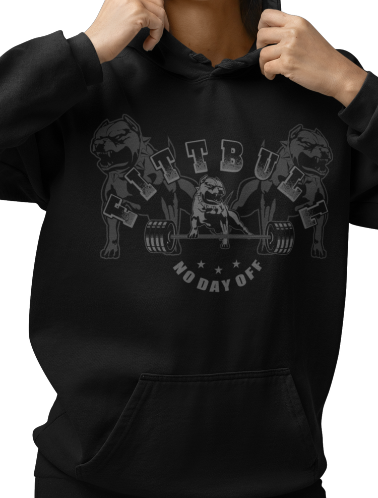 A woman wear black hoodet fitness sweatshirt Fitbull, with motivation desighn No Day Off.