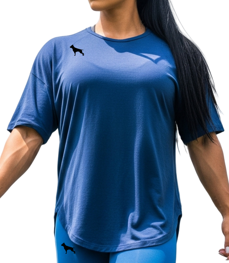 Woman in athletic Fitbull wear walking a  pitbull dog  at an outdoor gym.