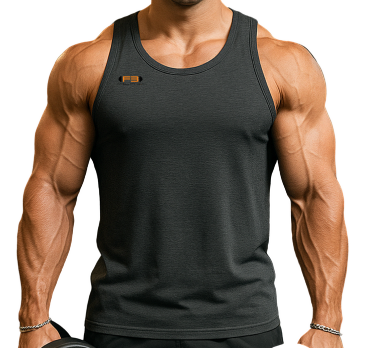 Muscular man wearing Fitbull Tank Top with brand logo, holding dumbbells in a gym.