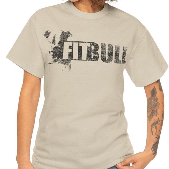 Woman wearing beige Fitbull fitness t-shirt with motivational design on the chest.