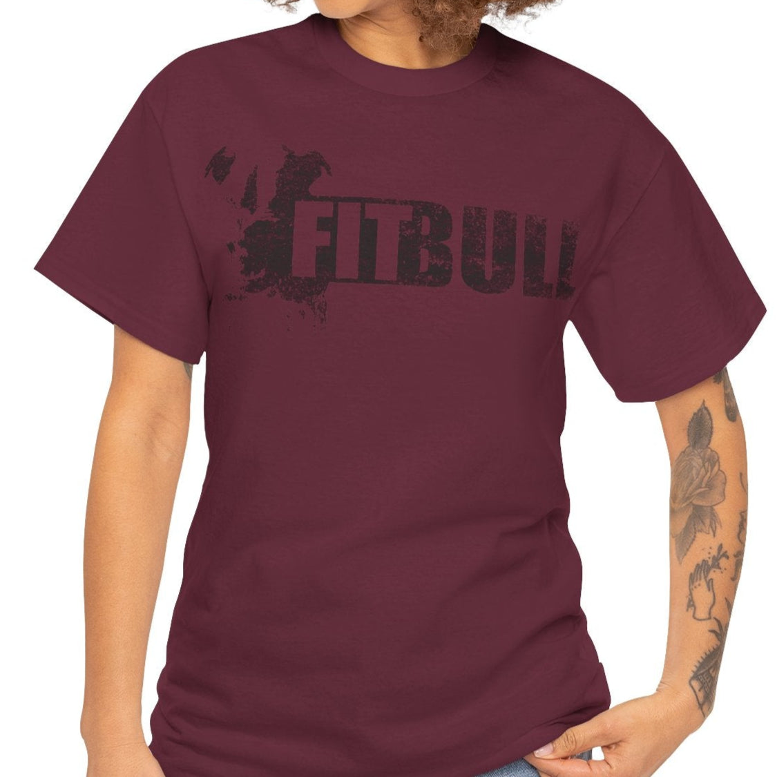 Woman wearing a maroon fitness t-shirt with 'Fitbull' training motivating.