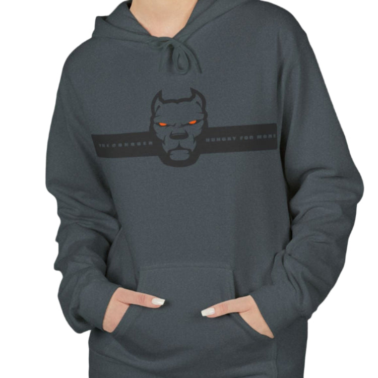 woman wearing naa sporty hoodie for fitness and bodybuilding training by the brand Fitbull, branded with a logo and a motivating motif front viewy