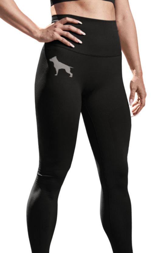 Woman in black Fitbull athletic leggings  with brand logo stylized figure of a pitbull.