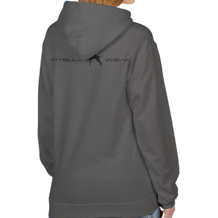 A woman wear sports sharcoal hoodet, fitness sweatshirt Fitbull, with motivation desighn Unleash The Beast, back view.