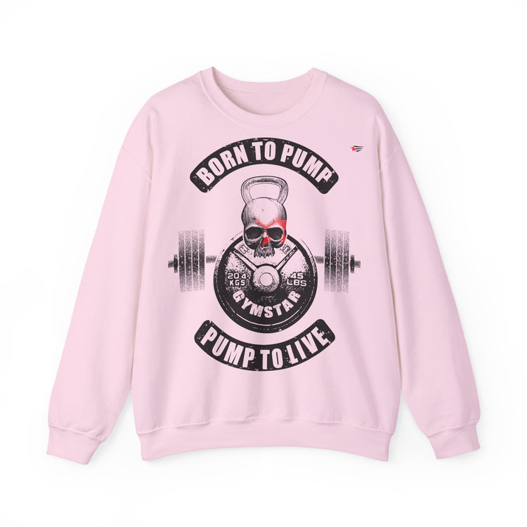 A light pink crewneck sweatshirt featuring a gym-themed graphic print on the front with a skull, kettlebell, barbell, and the text 'BORN TO PUMP' and 'PUMP TO LIVE'.