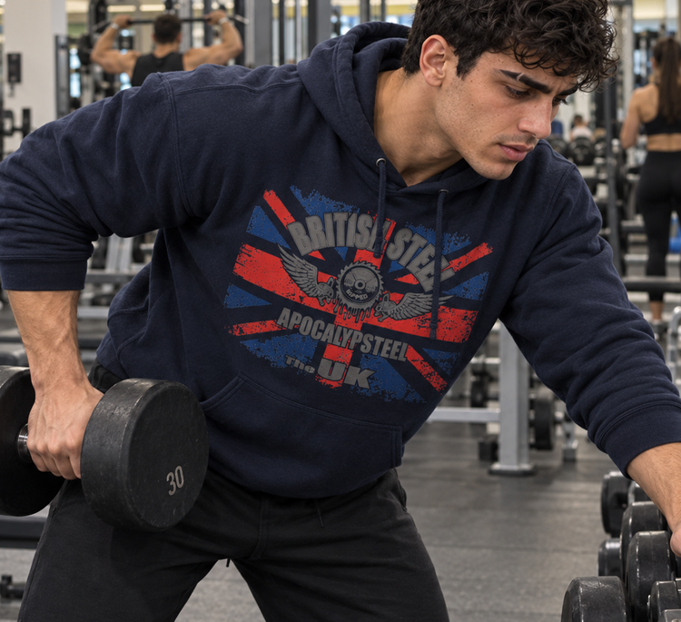 Luca Moretti wearing a navy GYMSTAR British Steel hoodie while performing a dumbbell row, with other people training behind him.