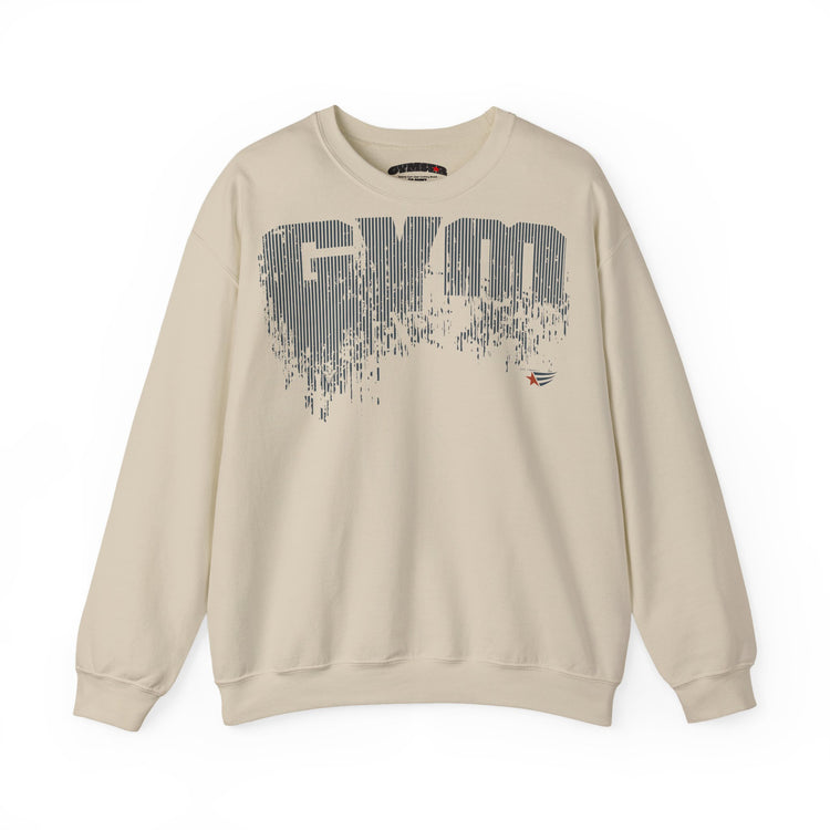 A beige crewneck sweatshirt featuring a large, distressed gray 'GYM' graphic across the chest, with a small red and blue logo on the right side of the graphic, displayed on a clean white background.