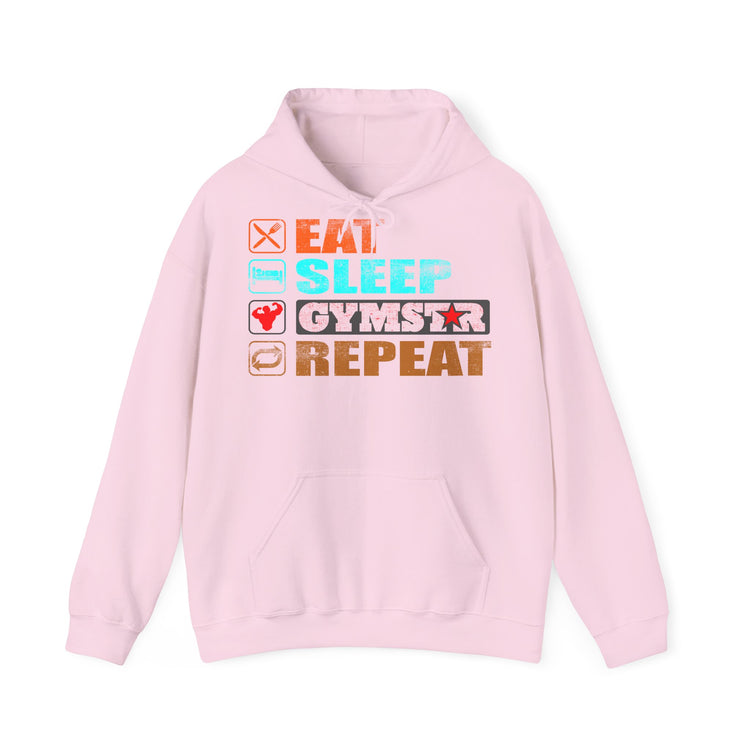 A light pink pullover hoodie with a graphic text design on the chest reading 'EAT SLEEP GYMSTAR REPEAT' with corresponding food and fitness icons, shown on a plain white background.
