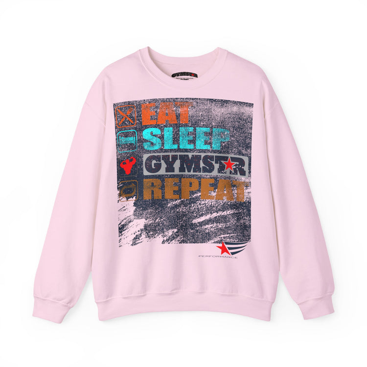 A light pink crewneck sweatshirt featuring a large, colorful graphic print on the front with the text 'EAT SLEEP GYMSTAR REPEAT' in various colors over a distressed background.