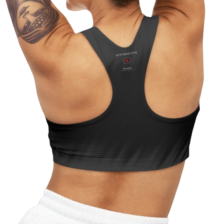 A woman wearing Black Grey sports, fitness bra from the Gimstar brand, with white seams and a small logo on the left side. Rear view.