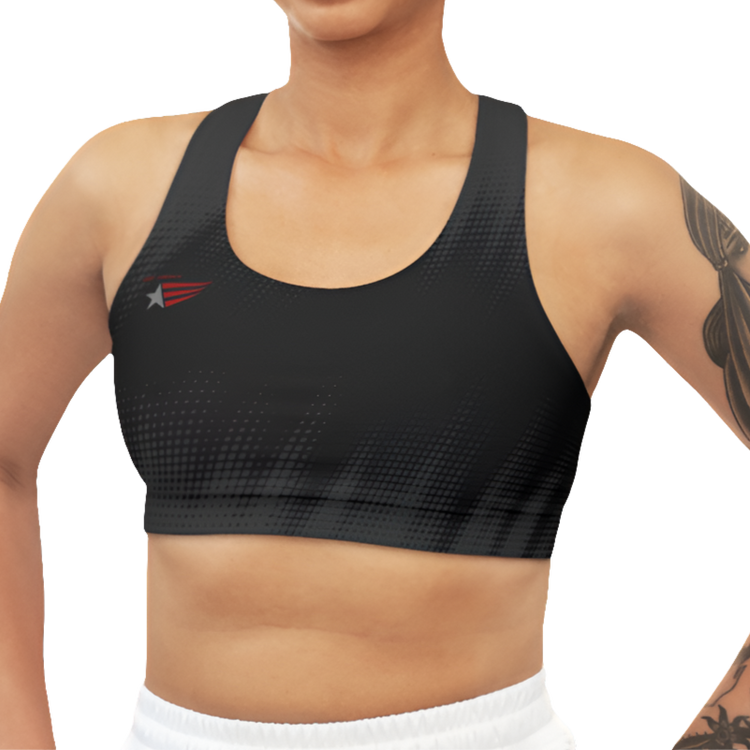 A woman wearing Black Grey sports, fitness bra from the Gimstar brand, with white seams and a small logo on the left side. Front view.