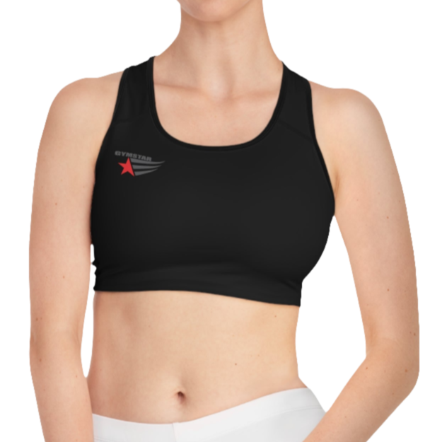 A women's solid black athletic sports bra Gymsatr. It features black trim around the neckline and armholes. A logo with a red star and three black stripes is on the left side of the chest, with the text "GO HEAVY" above it.