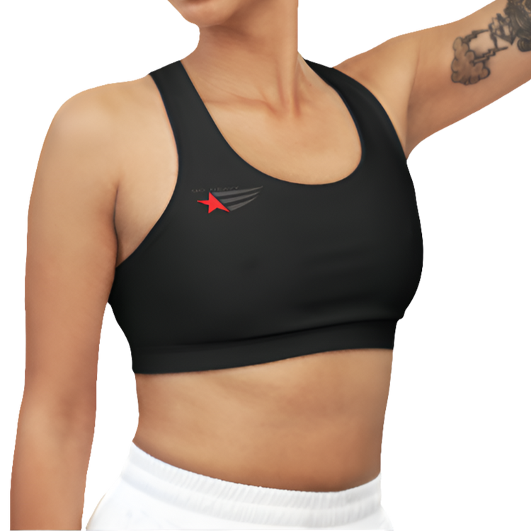 A woman wearing Black  sports, fitness bra from the Gimstar brand, with white seams and a small logo on the left side. Right side view.