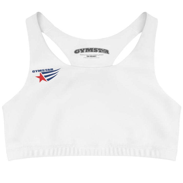 A women's solid white athletic sports bra Gymstar. It has a scoop neckline and a racerback style. A logo with a red star and three black stripes is on the left chest, with the brand name "GYMSTAR" in black text above it. The main brand tag with "GYMSTAR" is visible on the inner back neckline.