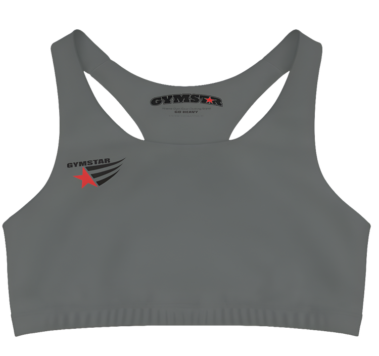 A women's solid grey athletic sports bra Gymstar. It has a scoop neckline and a racerback style. A logo with a red star and three black stripes is on the left chest, with the brand name "GYMSTAR" in black text above it. The main brand tag with "GYMSTAR" is visible on the inner back neckline.