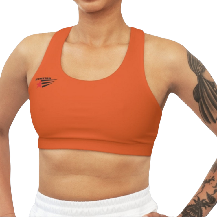 A woman wearing Orange,  sports, fitness bra from the Gimstar brand, with  a small logo on the left side. Front view.