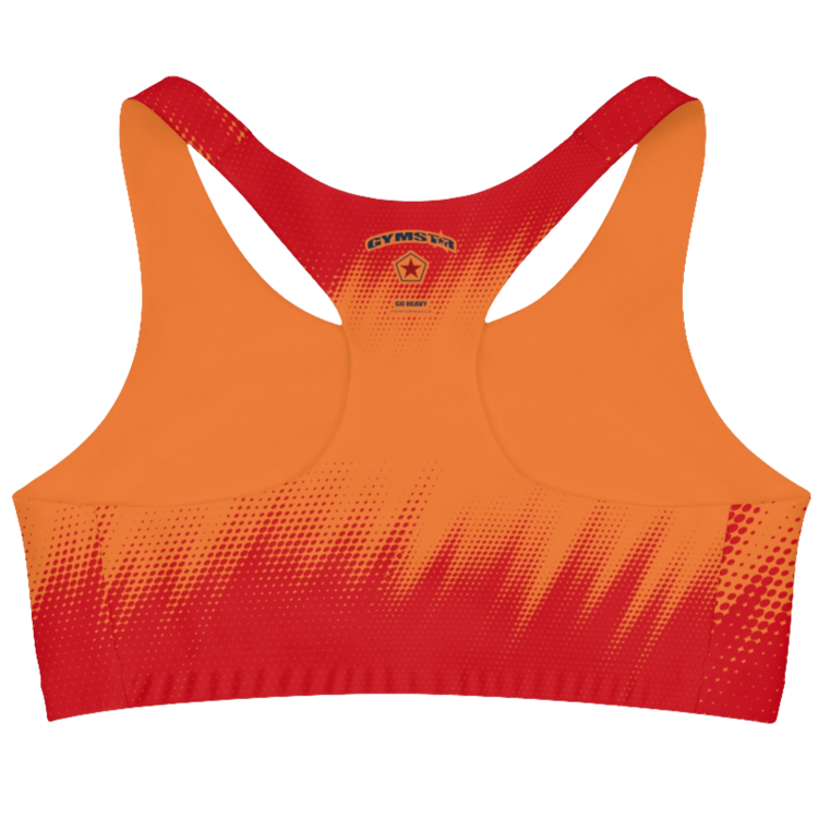 A women's athletic sports bra Gymstar. It is primarily red with a orange, dotted, gradient pattern that radiates from the sides and bottom. The straps are solid red. A small logo is on center of the back.