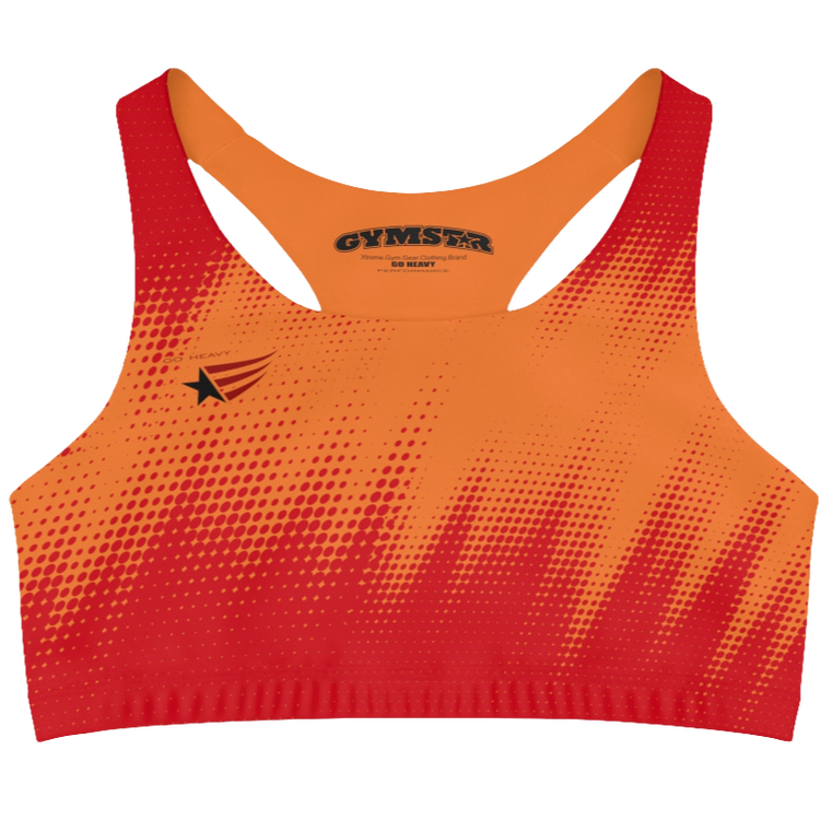 A women's athletic sports bra Gymstar. It is primarily red with a orange, dotted, gradient pattern that radiates from the sides and bottom. The straps are solid red. A small logo featuring a star and three red and blue stripes is on the left side of the chest.