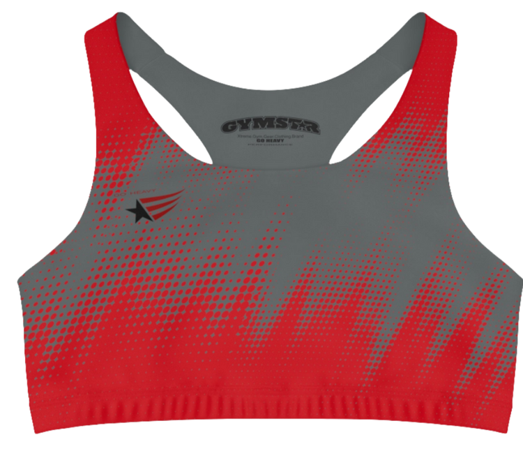 A women's athletic sports bra, shown from the front. The main body is gray with a red, dotted, gradient pattern that radiates from the sides and bottom. The straps are solid red and form a racerback style at the back. A small logo featuring a star and three red and blue stripes is on the left side of the chest.