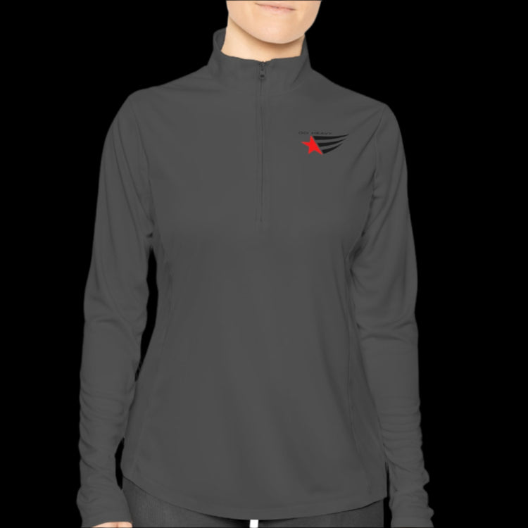 A person wearing a grey half-zip sweatshirt with logo printed on the front.