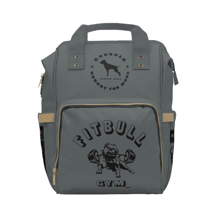 A gray FITBULL gym backpack with a logo that includes a stylized bull and the text 'FITBULL GYM', featuring multiple pockets and a padded shoulder strap design.