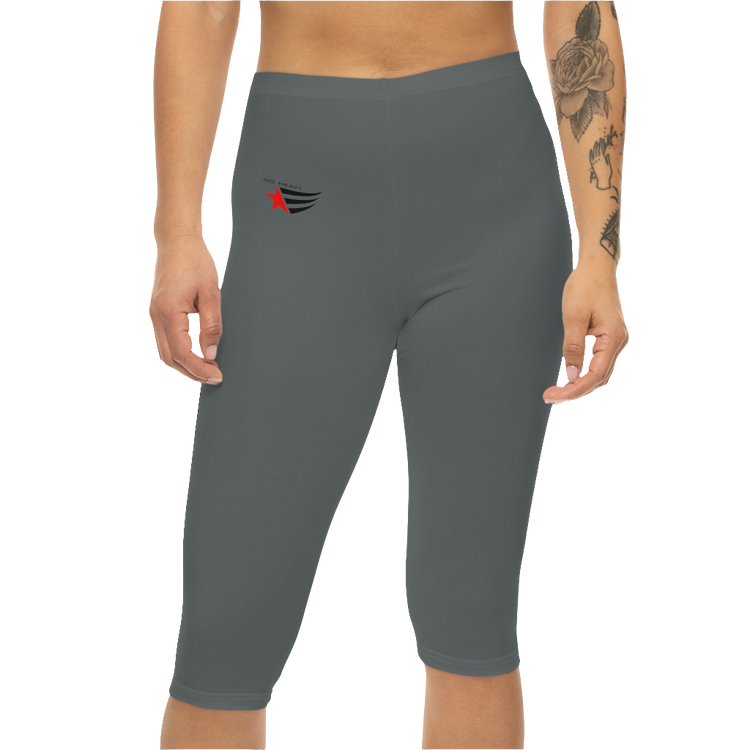 A woman wearing pair of gray Gymstar brand fitness leggings featuring a mid-rise waist and a logo, designed for yoga and other workouts. Front close up view.