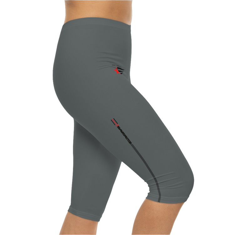 A woman wearing pair of gray Gymstar brand fitness leggings featuring a mid-rise waist and a logo, designed for yoga and other workouts. Right side close up view.
