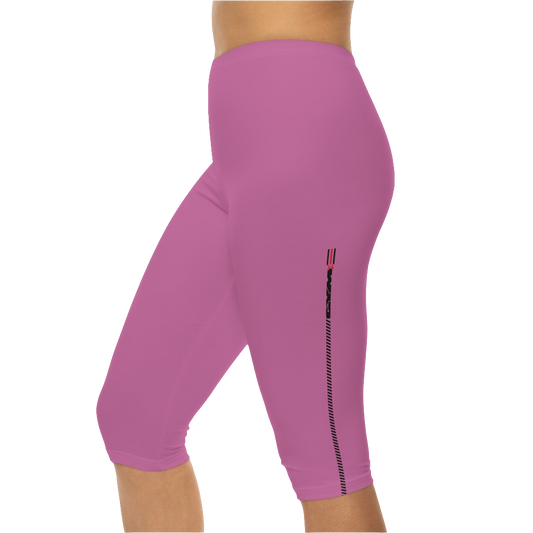 A woman wearing a pair of red-purple Gymstar fitness leggings with a small logo on the left thigh area, designed for women training and joga. Left side close up view.