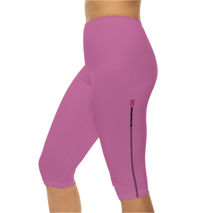A woman wearing a pair of red-purple Gymstar fitness leggings with a small logo on the left thigh area, designed for women training and joga. Left side close up view.