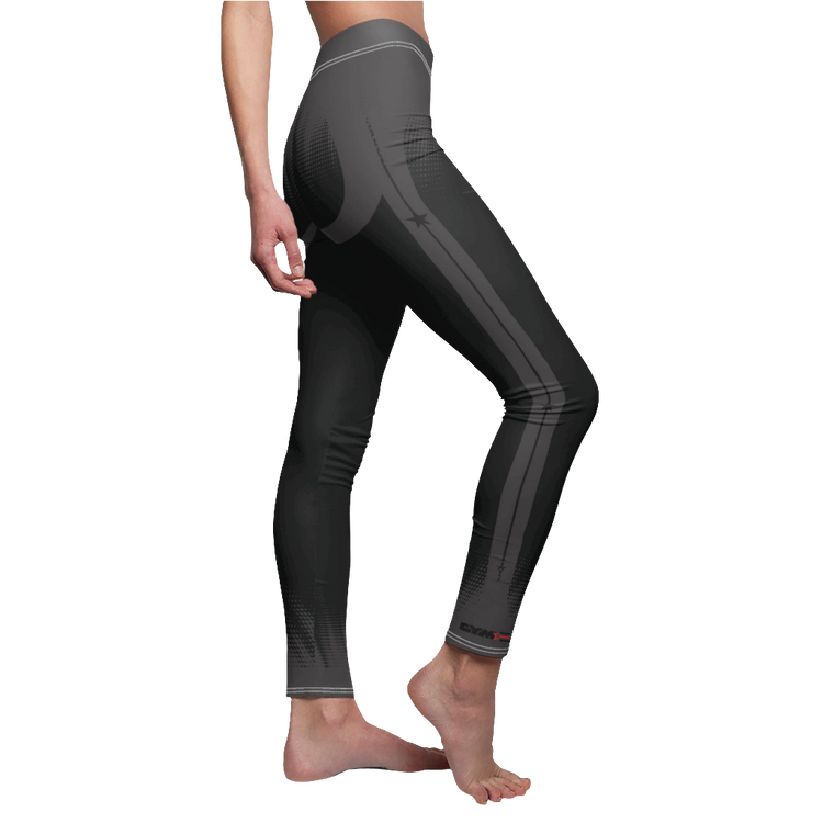 A female fitness model wearing pair of black Gymstar women's fitness leggings with capri cut, featuring white seam stitching and a mid-rise waist and art design.  Right side close up view.