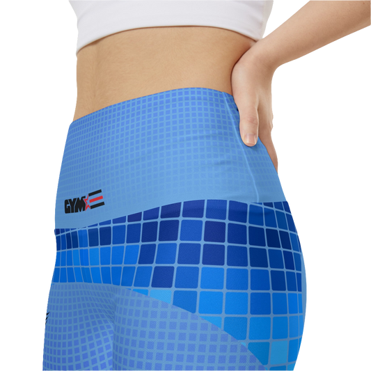 A woman wearings blue patterned GYMSTAR shorts with branding logo. Left side extemelly  close up vew.
