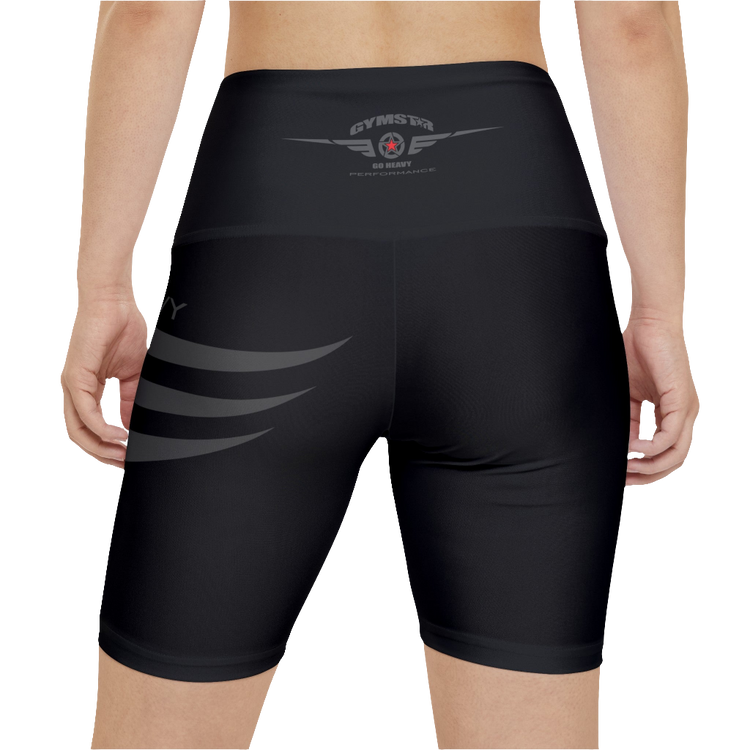 A woman wearing pair of black Gymstar fitness leggings with a mid-rise waist and white seam stitching. The leggings are designed for functionality and aesthetics, suitable for various workouts including yoga and crossfit. Rear close up view.