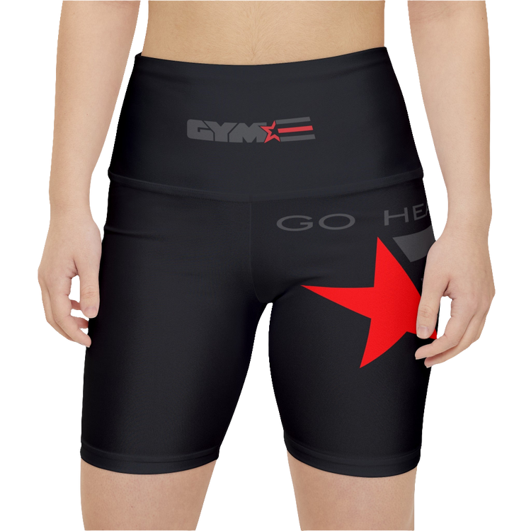 A woman wearing pair of black Gymstar fitness leggings with a mid-rise waist and white seam stitching. The leggings are designed for functionality and aesthetics, suitable for various workouts including yoga and crossfit. Front close up view.