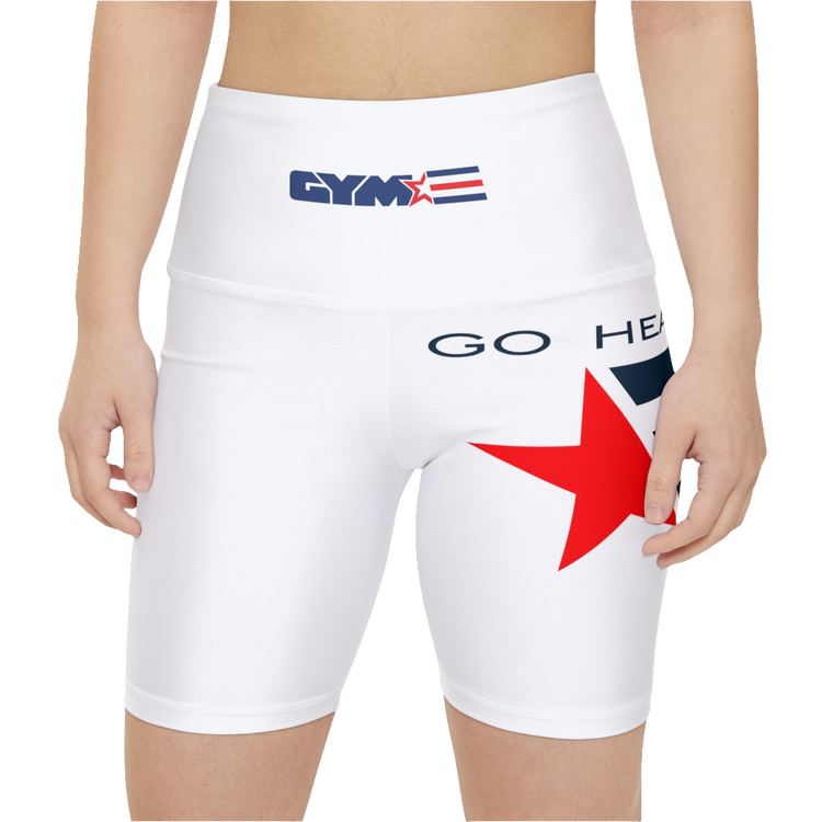 A woman waering pair of white Gymstar workout leggings with a blue and red star design on the side, featuring the logo on the elastic waistband. Front close up view